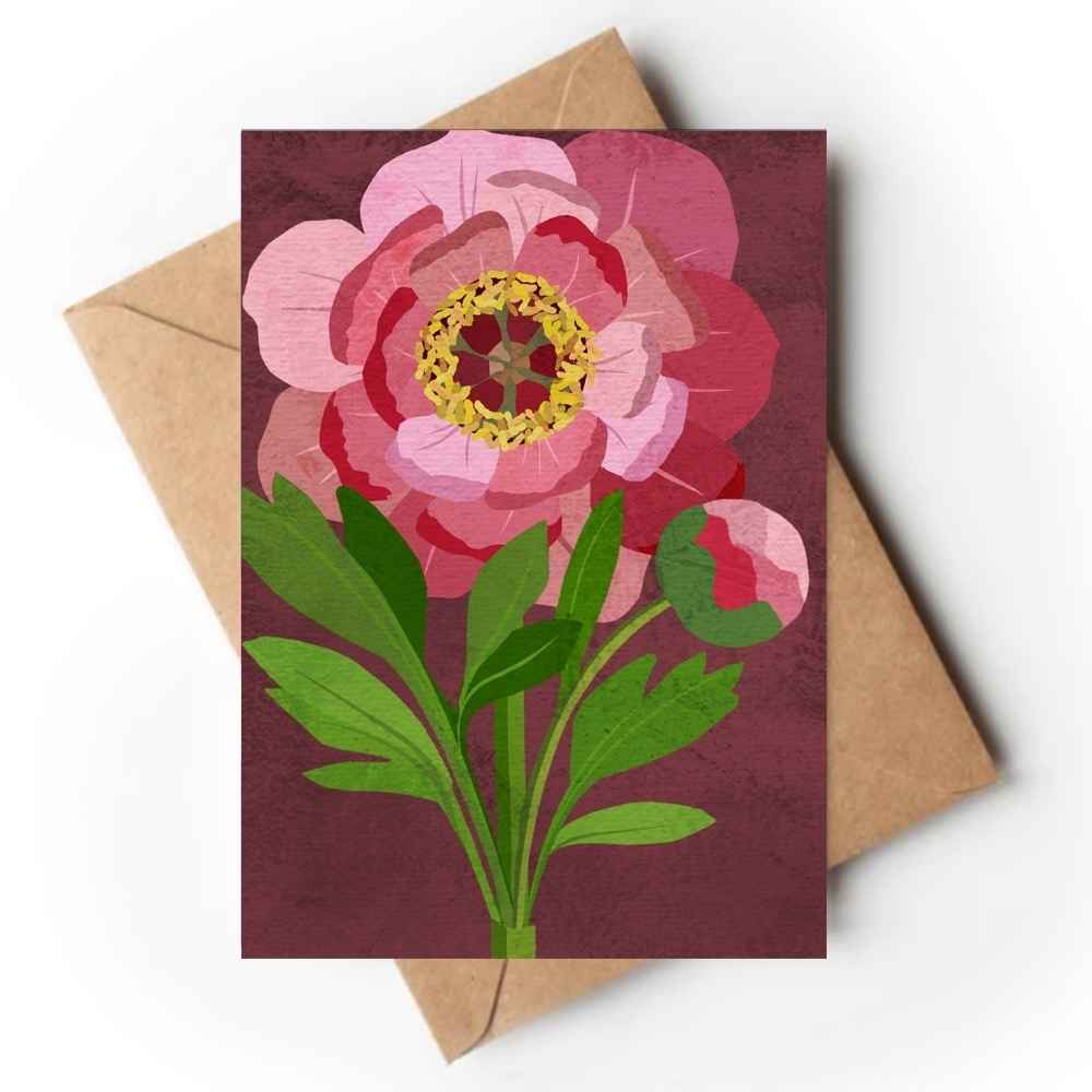 A rectangular art print or card featuring a stylized pink flower with green leaves on a dark burgundy background, placed over a brown kraft envelope on a white studio background.