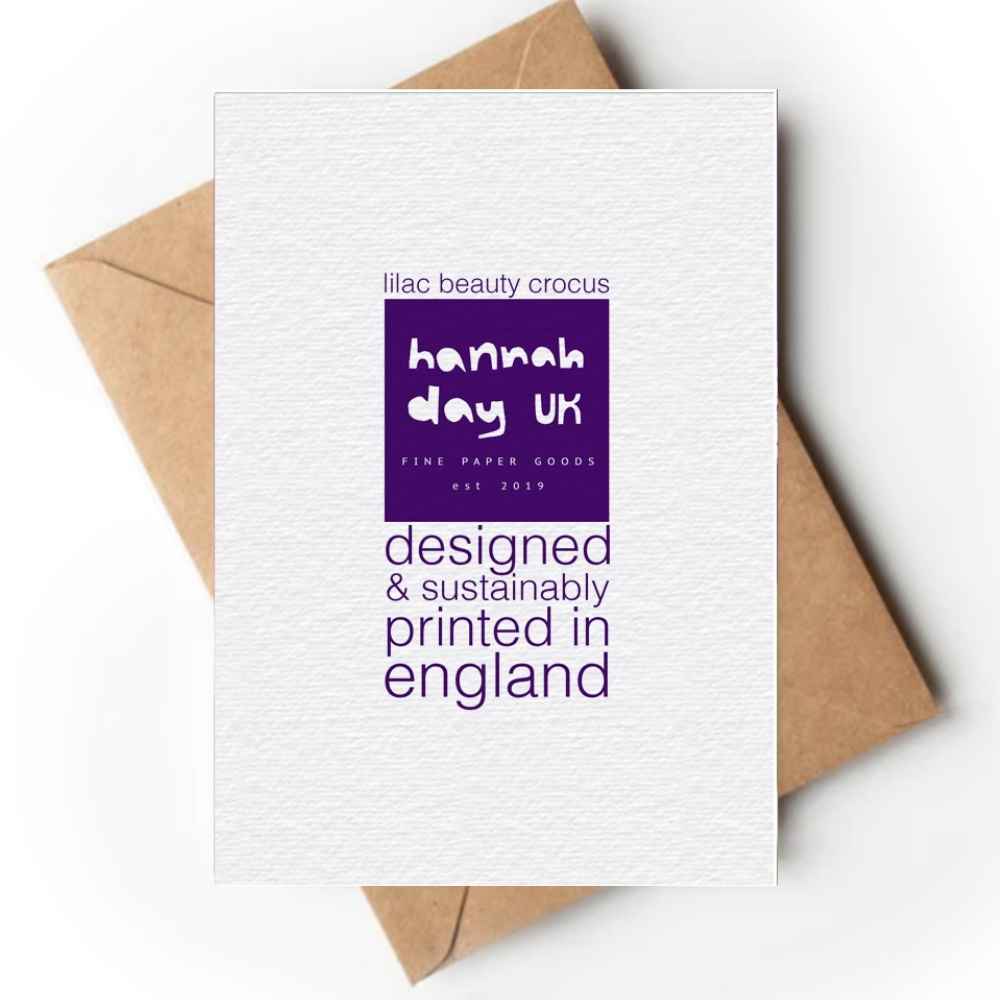 The reverse of a mini white textured paper card with purple text and a purple logo block reading 'hannah day uk', shown on top of brown kraft envelopes against a white background.