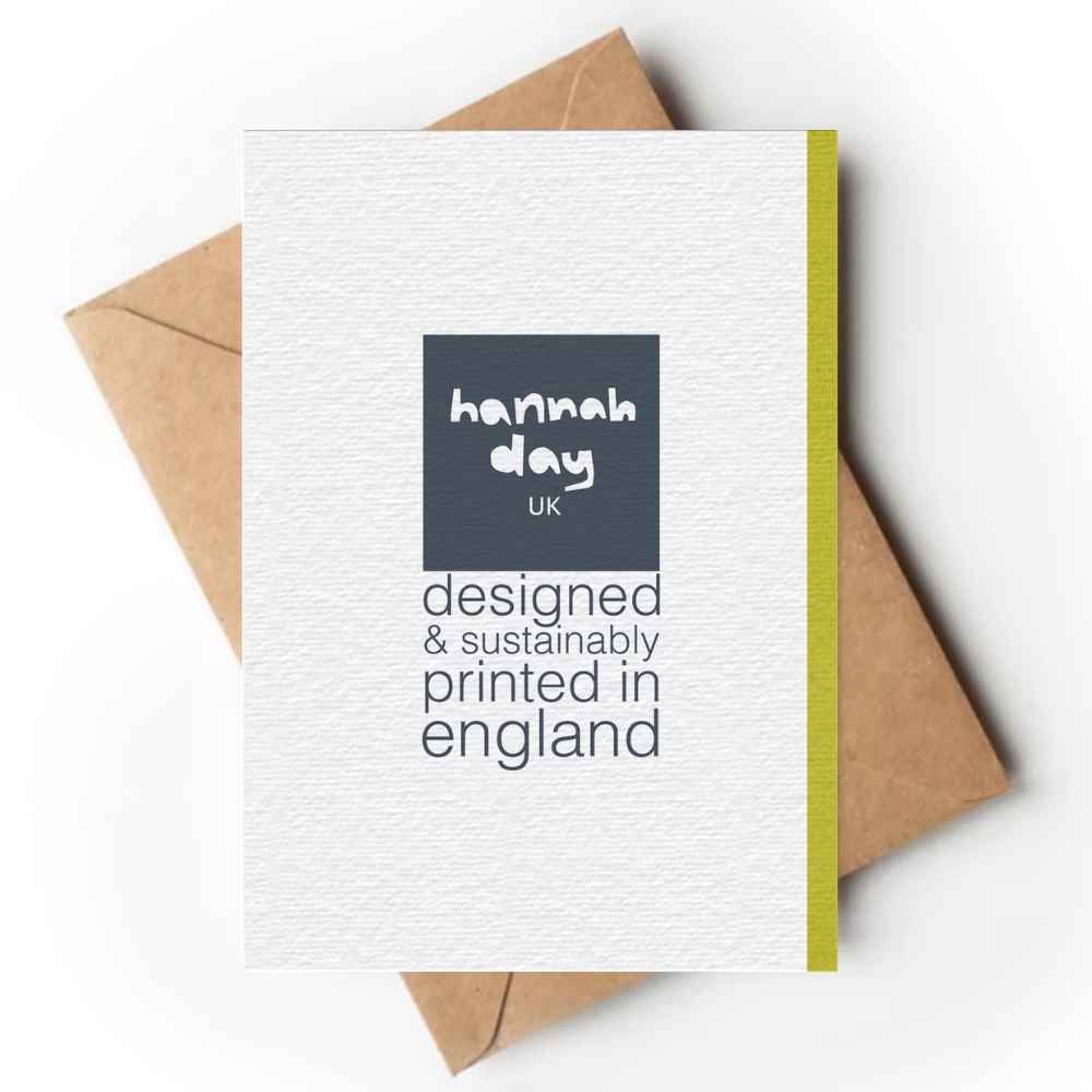 A white textured greeting card with a dark gray square logo reading 'hannah day uk' and the text 'designed & sustainably printed in england,' shown on top of brown kraft envelopes against a white background.