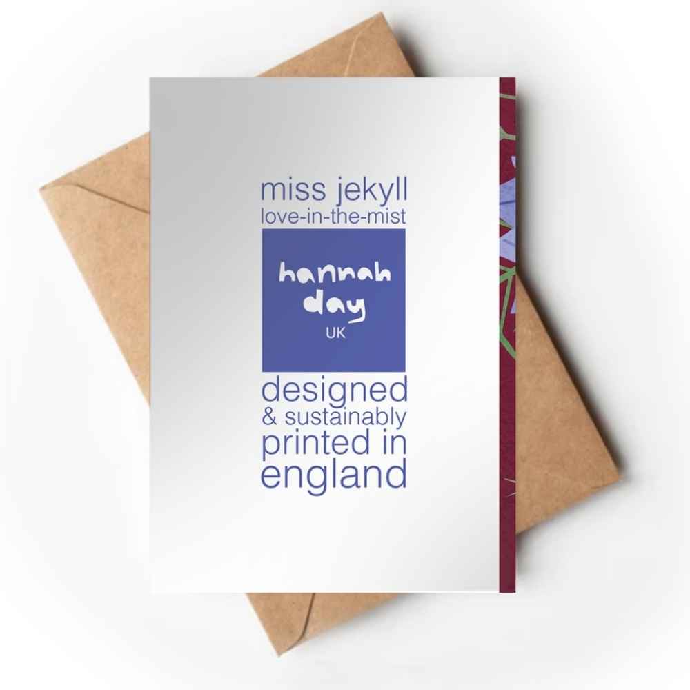 A white greeting card with blue text reading 'miss jekyll love-in-the-mist', a blue square logo reading 'hannah day uk', and 'designed & sustainably printed in england', shown with brown envelopes on a white background.