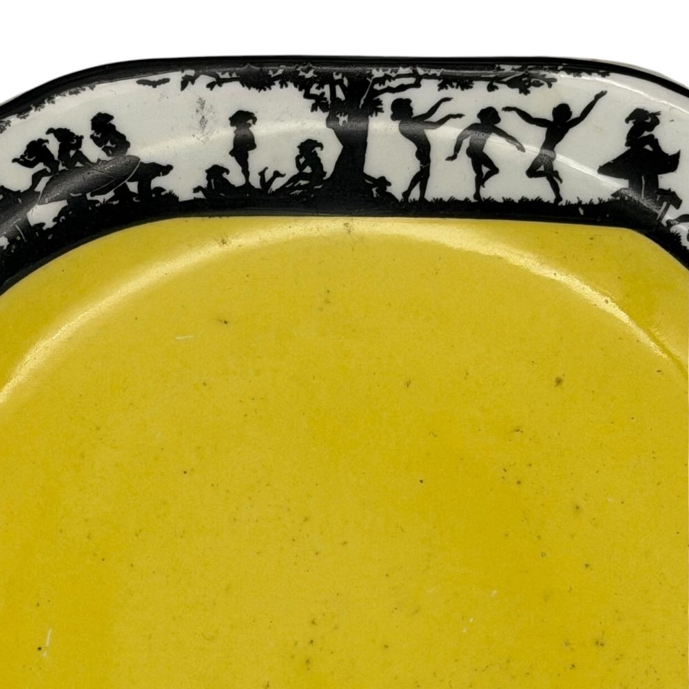 Black and yellow decorative plate with silhouette design depicting dancing figures c. 1930s - 20.5 X 23cm - Florrie