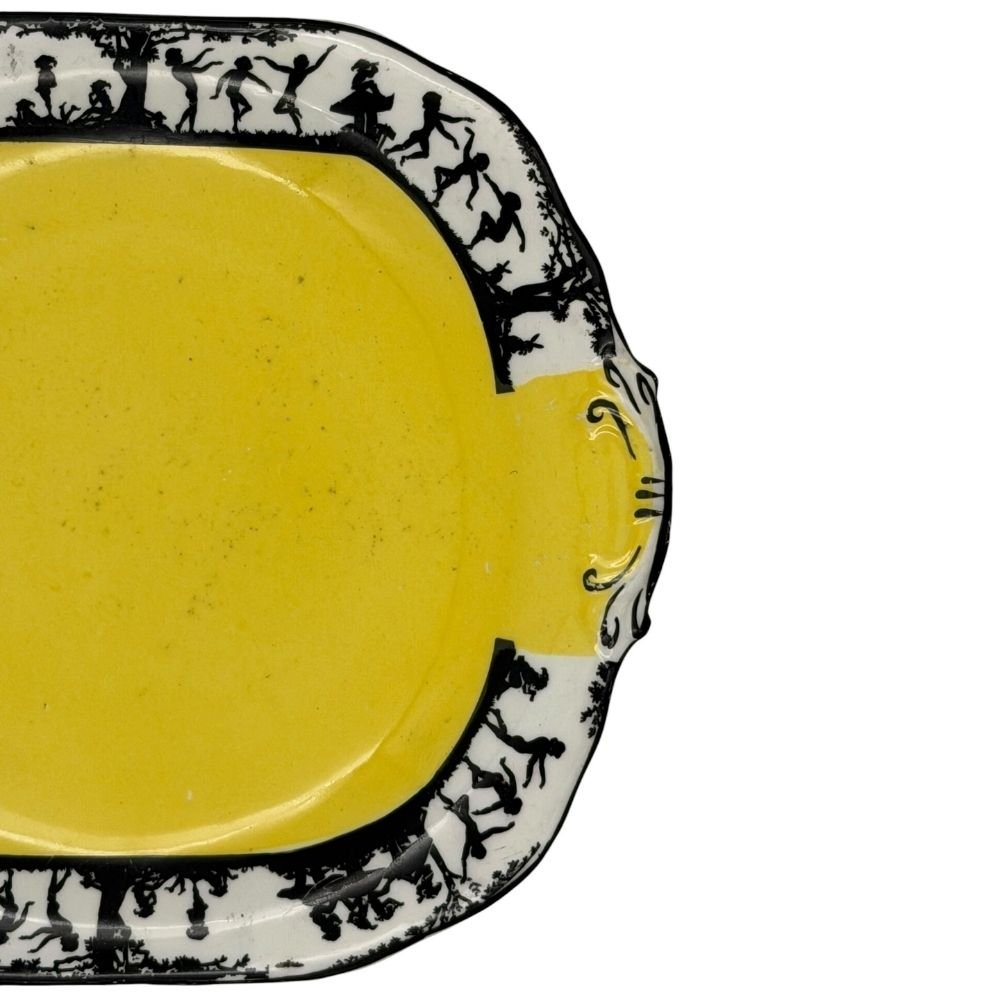 Black and yellow decorative plate with silhouette design depicting dancing figures c. 1930s - 20.5 X 23cm - Florrie