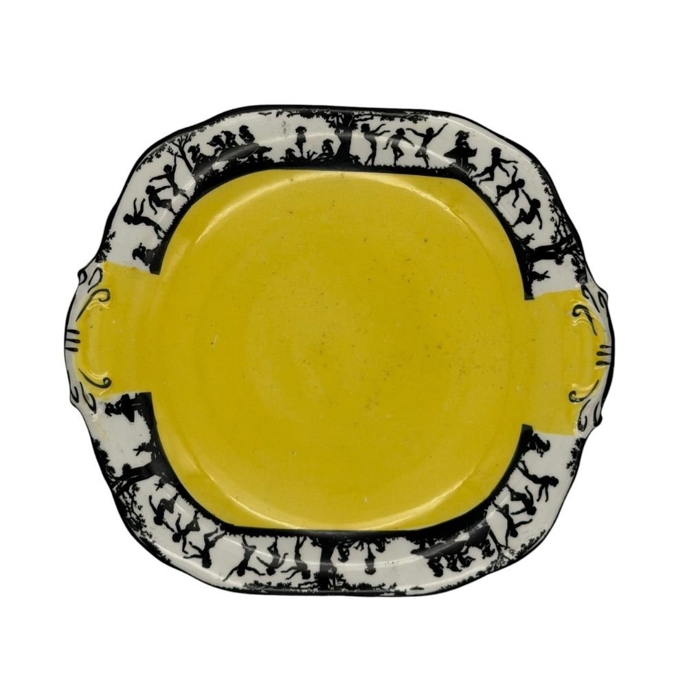 Black and yellow decorative plate with silhouette design depicting dancing figures c. 1930s - 20.5 X 23cm - Florrie